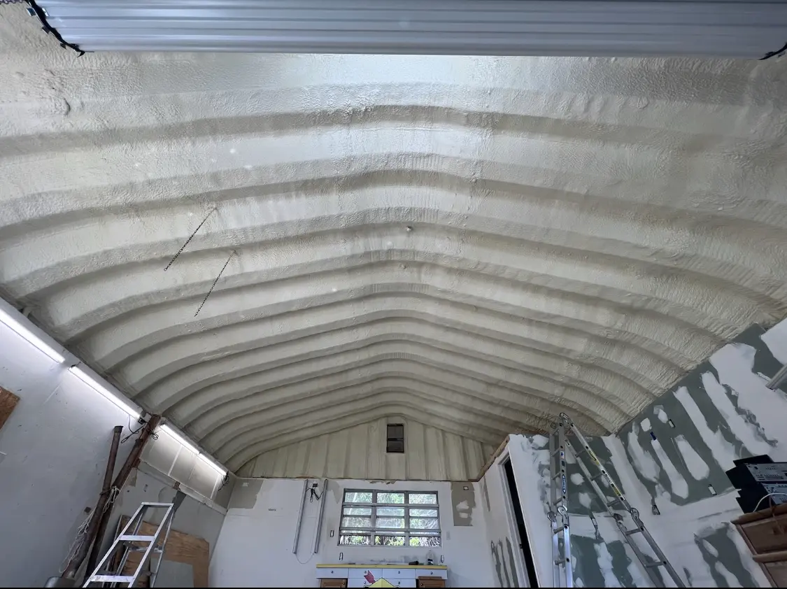 Spray polyurethane foam applied to the underside of a metal roof deck in Palatine